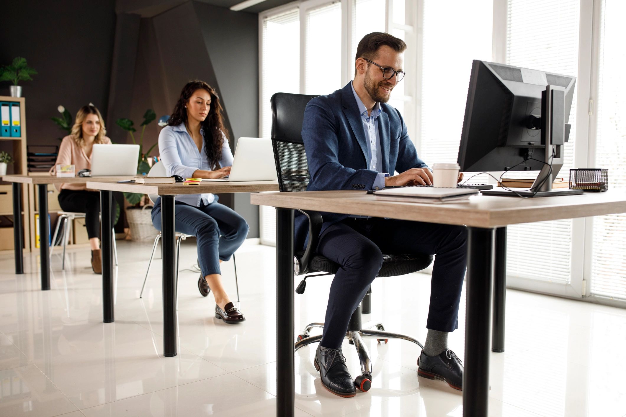 Business team working together in a technology-enabled office